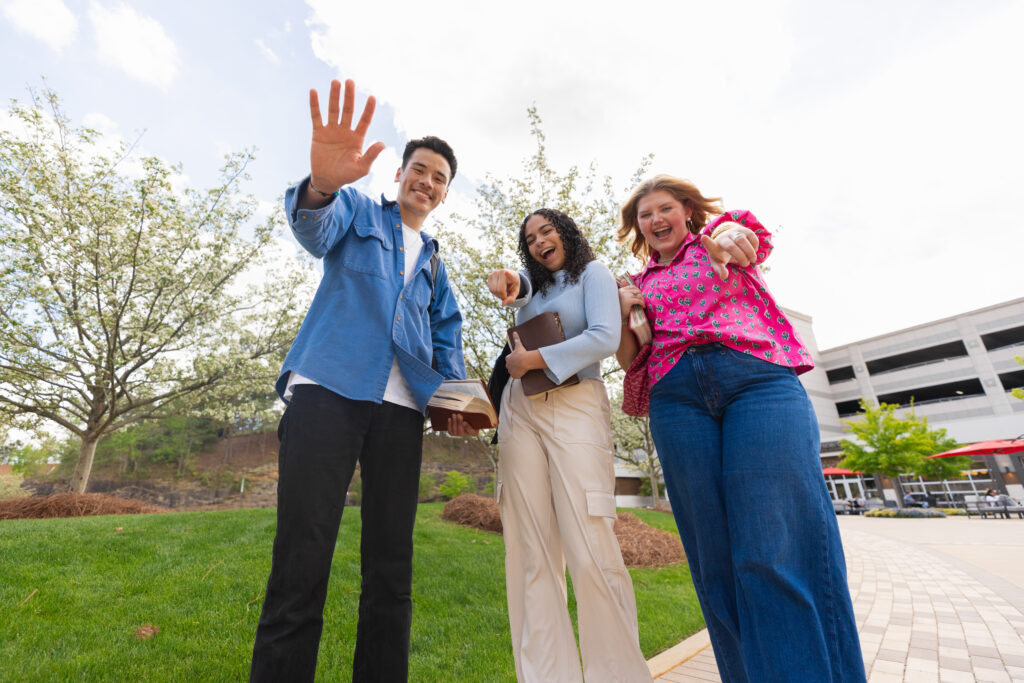 Highlands College students wave to the camera.