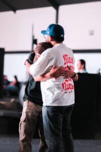 Randy ministers to a student at Grace Avenue's Student Night.