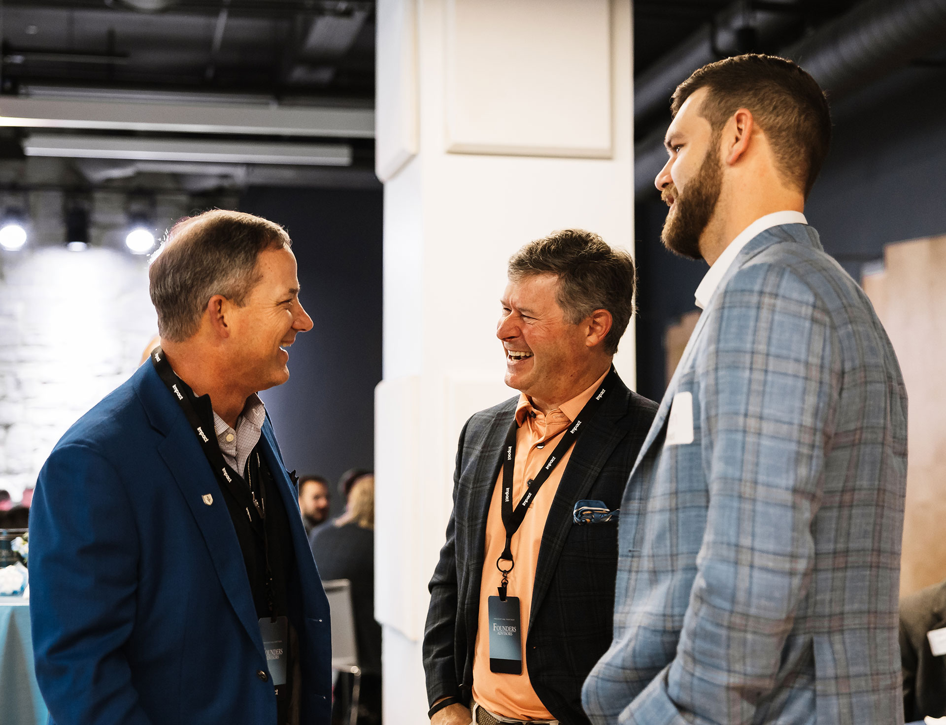 leadership conference guests laughing in conversation